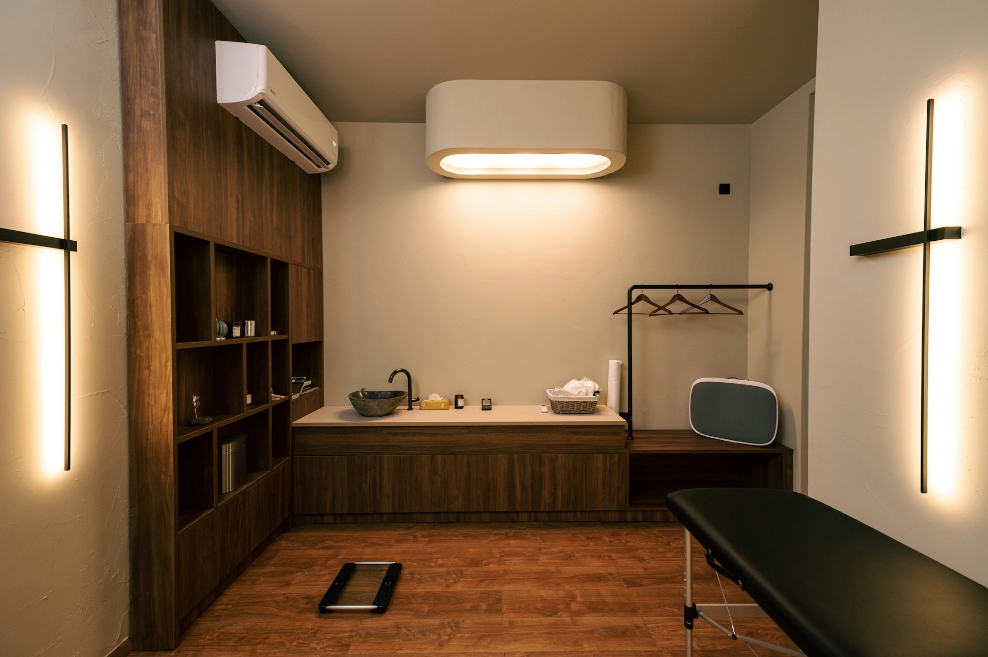 A tranquil and balanced spa room setup, ready for a hot and cold stone massage therapy session.